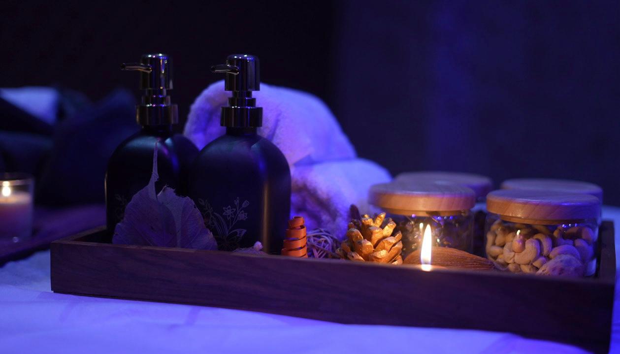 Spa oils and treatment tray with candles